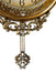 Decorative wall clock with intricate design and gold finish on a white background