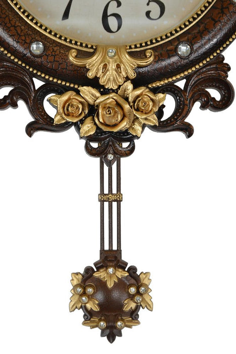 Decorative wall clock with floral design and pendulum on a white background
