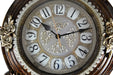 Decorative clock with floral designs on a white background