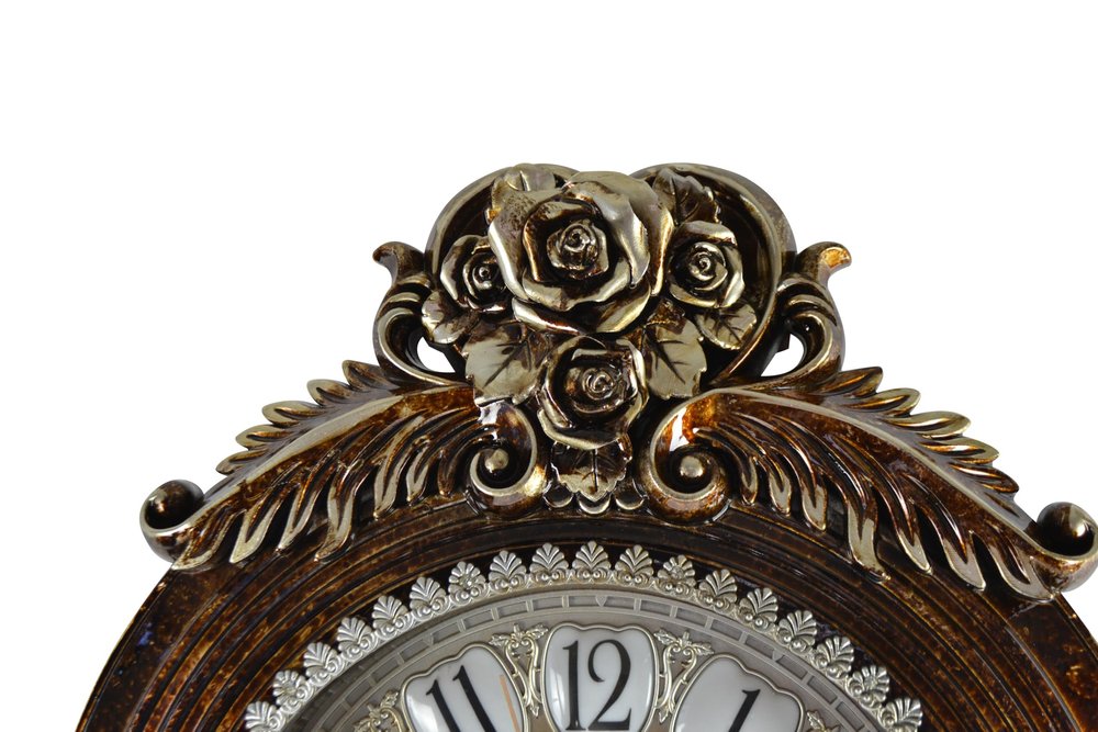 Decorative clock with floral design on a white background