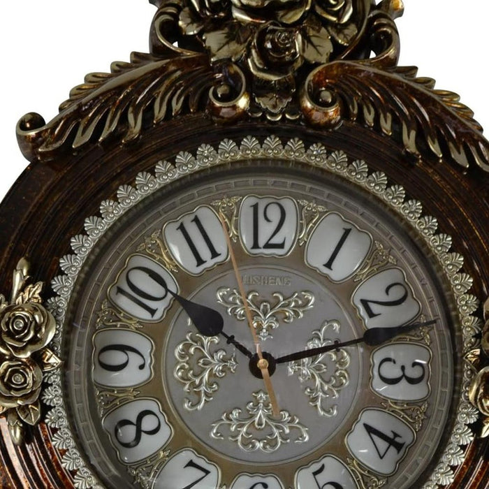 Decorative clock with intricate design and gold accents on a white background