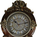 Decorative clock with floral designs on a white background