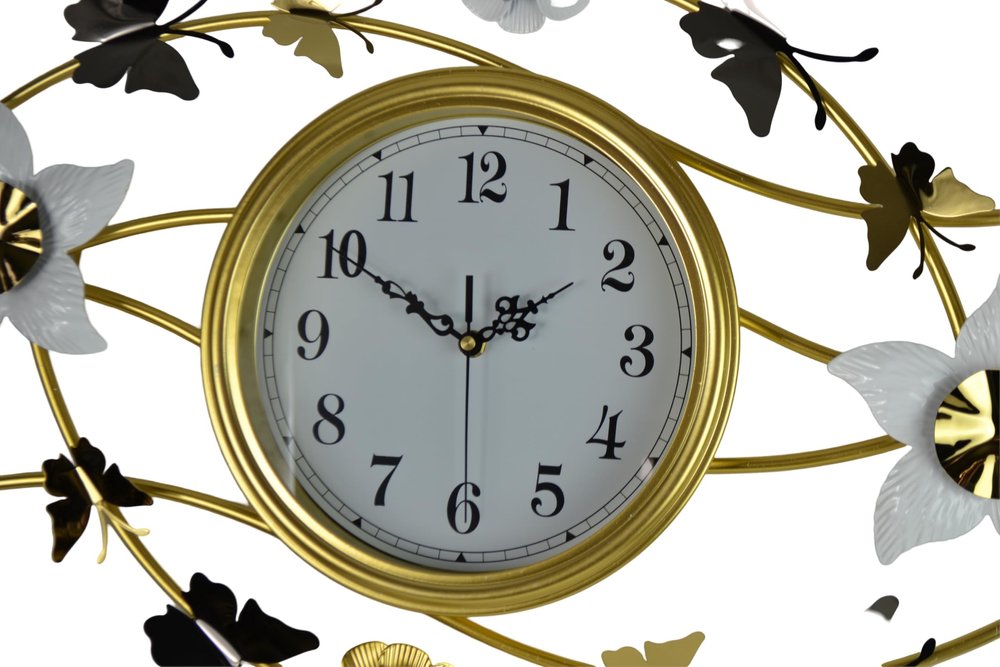 Decorative wall clock with gold frame and floral designs on a white background
