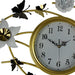 Decorative wall clock with gold frame, flowers, and butterflies on a white background