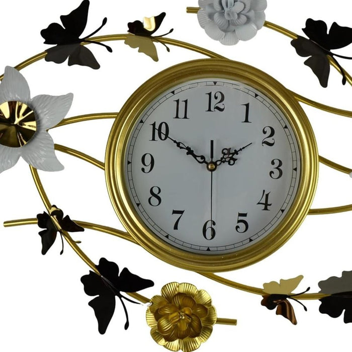 Decorative wall clock with floral and butterfly designs on a white background