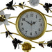 Decorative wall clock with floral and butterfly designs on a white background