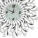 Decorative wall clock with floral design and metallic accents