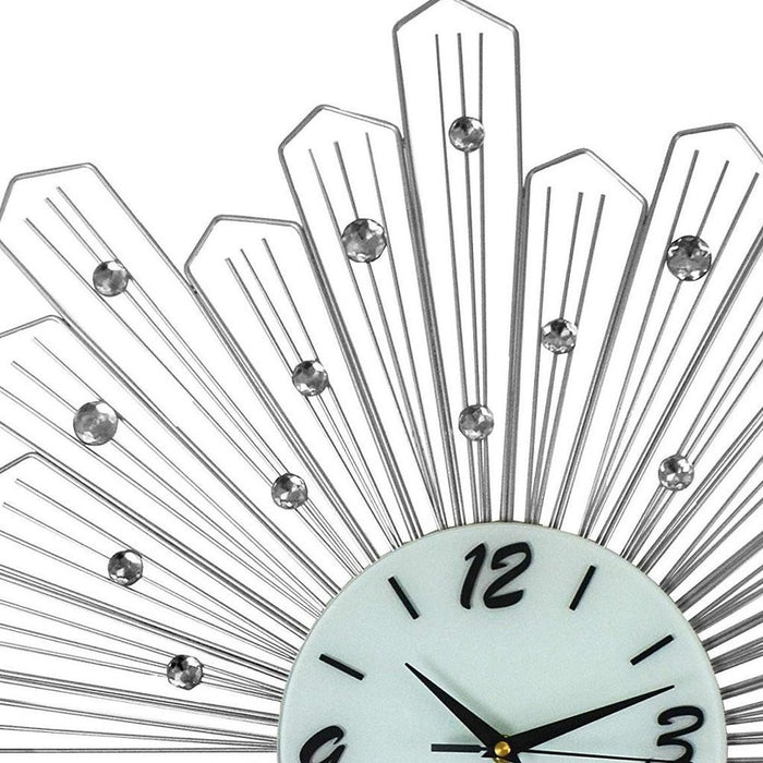 Decorative wall clock with fan-like design and gemstone accents