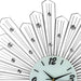 Decorative wall clock with fan-like design and gemstone accents