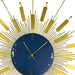 Decorative wall clock with gold sunburst design and blue center