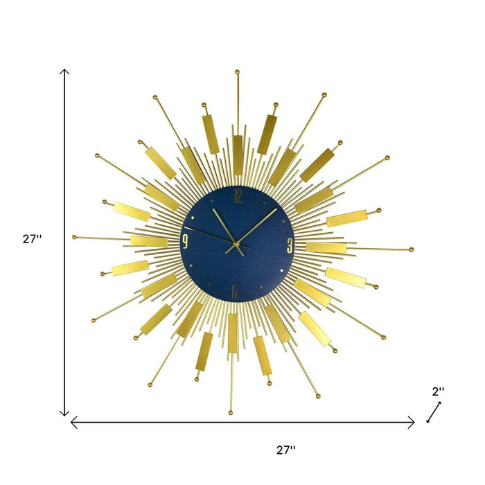 Decorative wall clock with a gold design on a white background