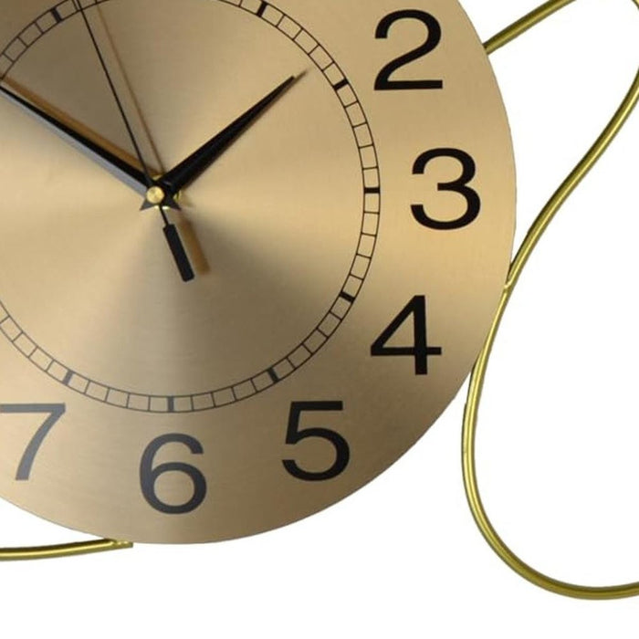 Gold clock with black numbers on a white background