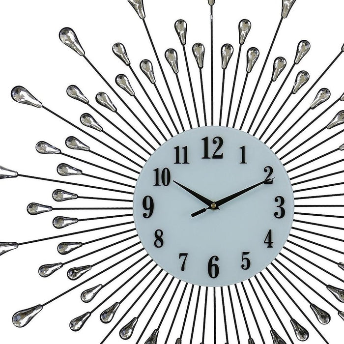 Decorative wall clock with sunburst design and metallic accents