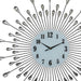 Decorative wall clock with sunburst design and metallic accents