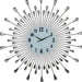 Decorative wall clock with sunburst design and teardrop accents on a white background