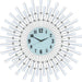 Decorative wall clock with sunburst design and white arms on a light blue face.