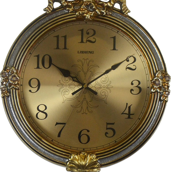 Decorative clock with gold and silver design on a white background