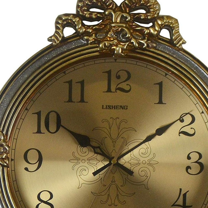 Decorative clock with gold face and ornate design on a white background