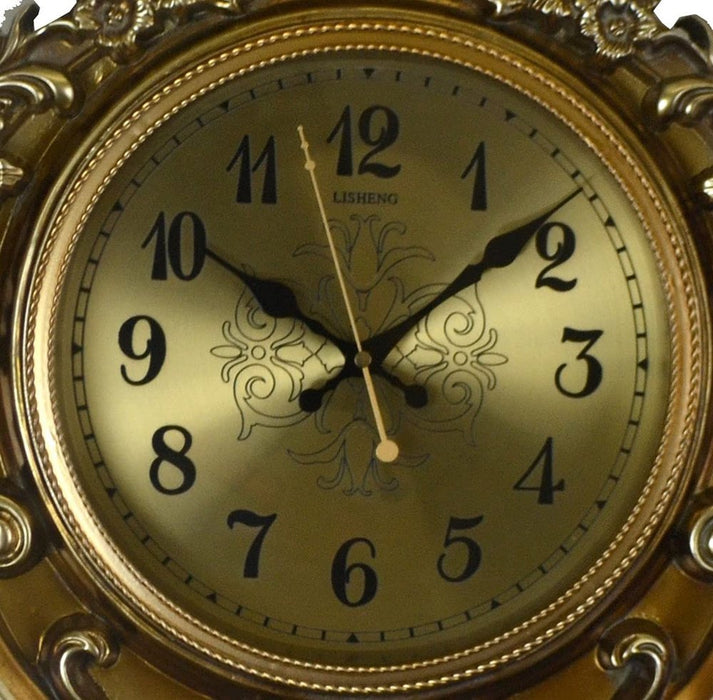 Gold ornate clock with black numbers and hands