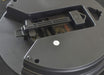 Close-up of a mechanical component inside a device, likely a printer or scanner.