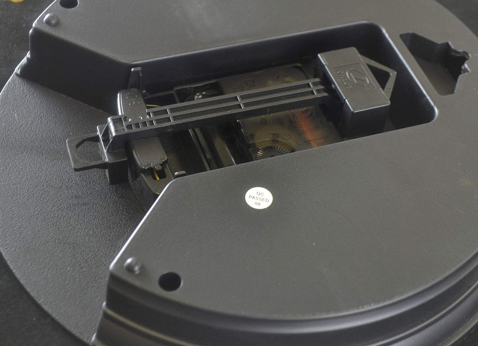 Close-up of a mechanical component inside a device, likely a printer or scanner.