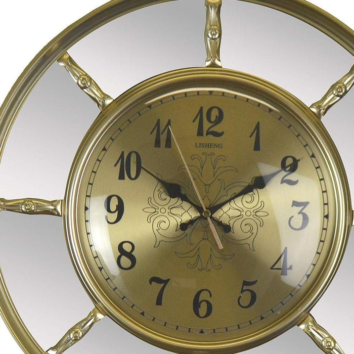 Gold clock with decorative design on a white background