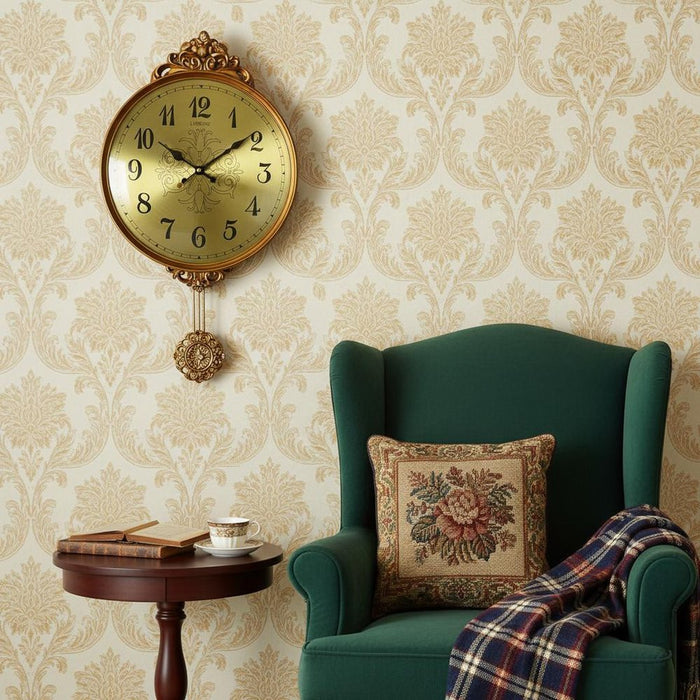 Decorative wall clock on a wall with a green armchair and small table below.