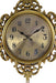 Decorative gold clock with intricate designs on a white background