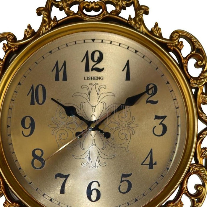 Decorative clock with gold frame and ornate design on a white background
