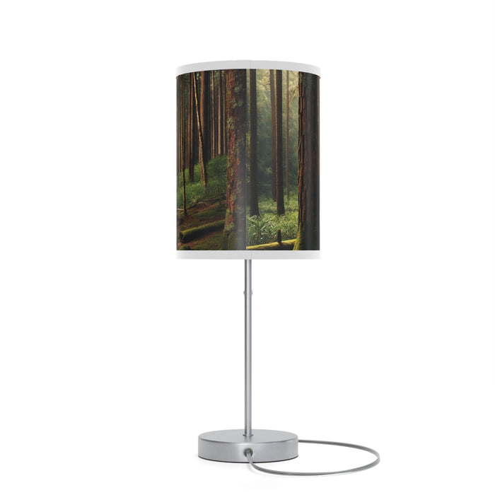 Wooded Forest Table Lamp, featuring a cylindrical shade with serene tall trees and vibrant greenery.