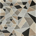 Geometric patterned rug with triangles in various shades of brown, gray, and black.