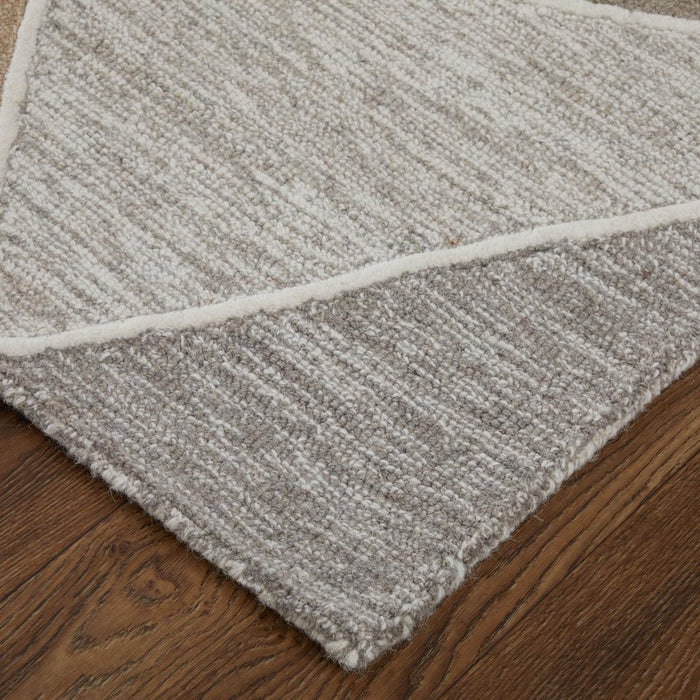 Gray textured rug on a wooden floor