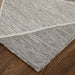 Gray textured rug on a wooden floor
