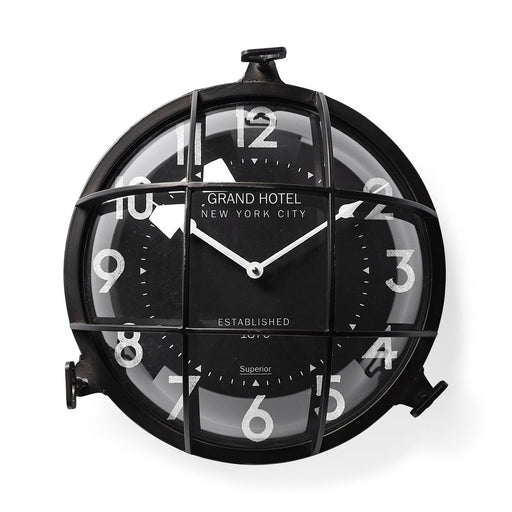 Black wall clock with 'Grand Hotel New York City' branding on a white background