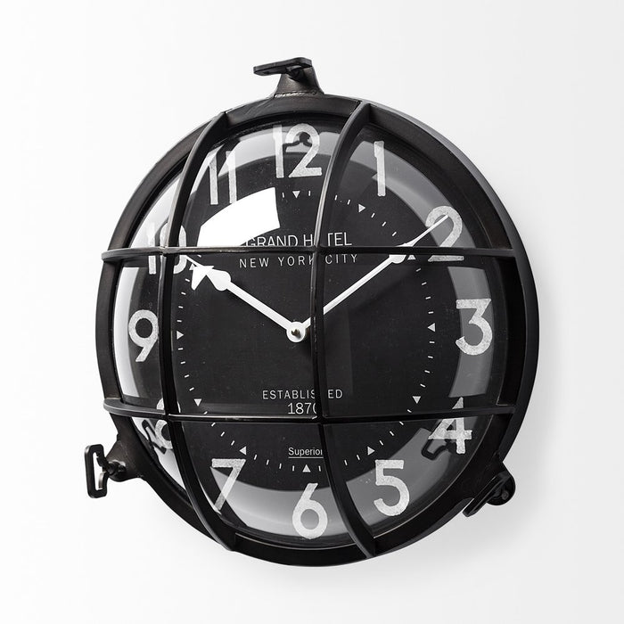 Black wall clock with transparent design on a white background