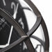 Close-up of a black metal clock with visible gears on a white background