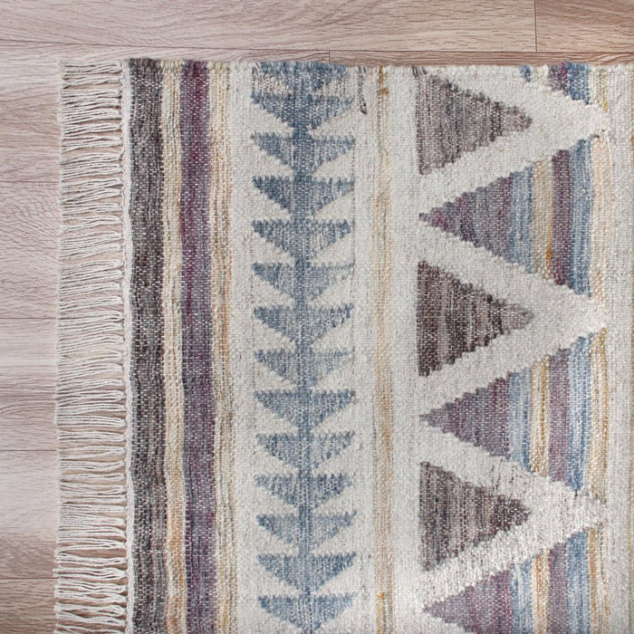 Patterned rug with geometric design on a wooden floor