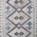 Close-up of a patterned rug with geometric design