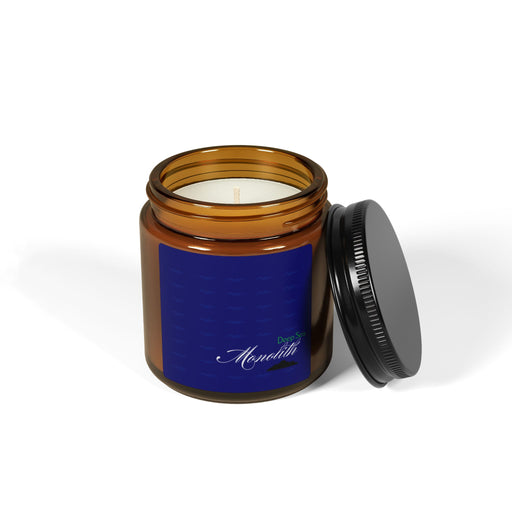 Brown jar candle with black lid off, revealing white wax and intricate blue label. Deep Sea Monolith Collection | 4 OZ.