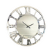 A round wall clock with a mirrored frame and reflective Roman numerals. The clock's minimalist design features two black hands for hours and minutes, with no second hand or numbers on the face. This modern wall clock's mirrored surface adds a contemporary and elegant touch to any decor. Introducing the Jeni Round Mirrored Wall Clock by Everly Quinn.